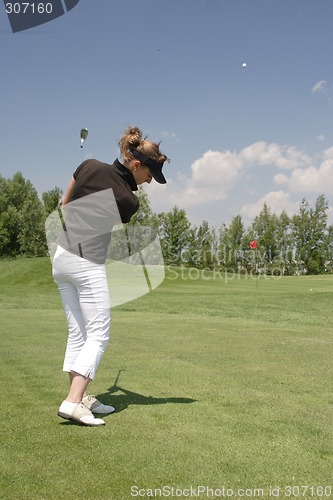 Image of Female golfer playing