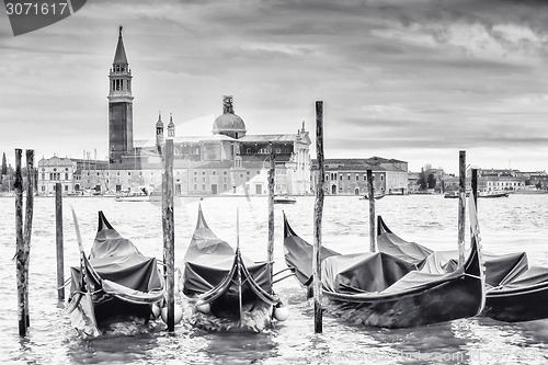 Image of Gondolas in front of San Giorgio Maggiore church b&w