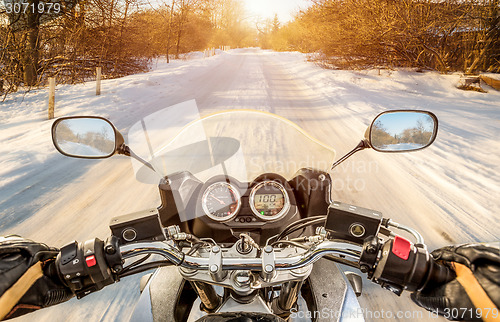 Image of Biker First-person view. Winter slippery road