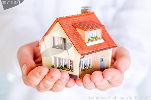 Image of House in human hands