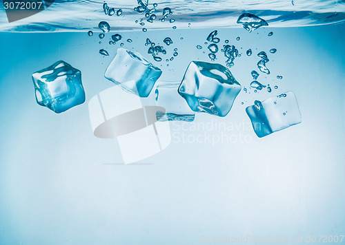 Image of Ice cubes falling under water