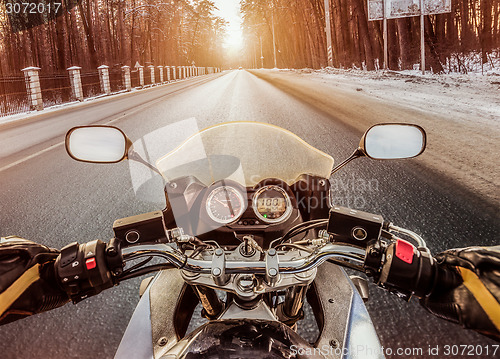 Image of Biker First-person view. Winter slippery road