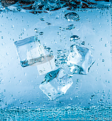 Image of Ice cubes falling under water