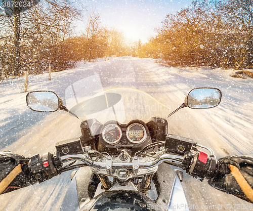 Image of Biker First-person view. Winter slippery road