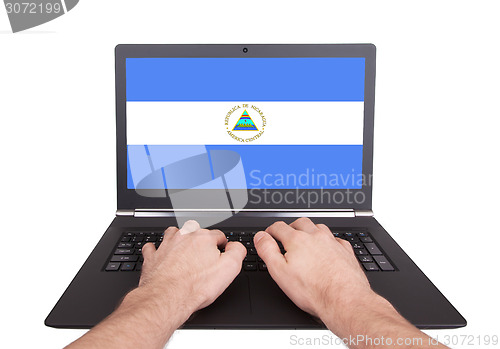 Image of Hands working on laptop, Nicaragua