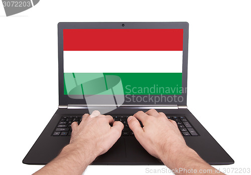 Image of Hands working on laptop, Hungary