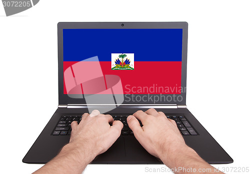 Image of Hands working on laptop, Haiti