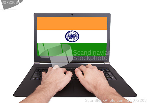 Image of Hands working on laptop, India