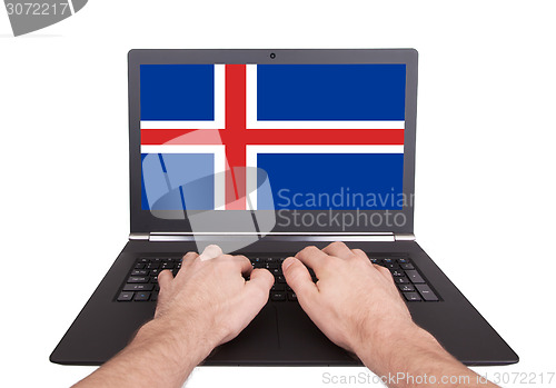 Image of Hands working on laptop, Iceland