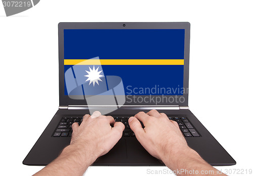 Image of Hands working on laptop, Nauru