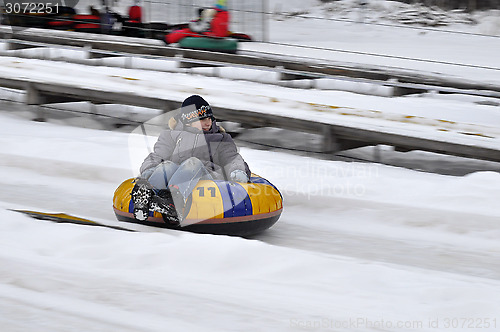 Image of The boy rides the route for a snoutyubing.