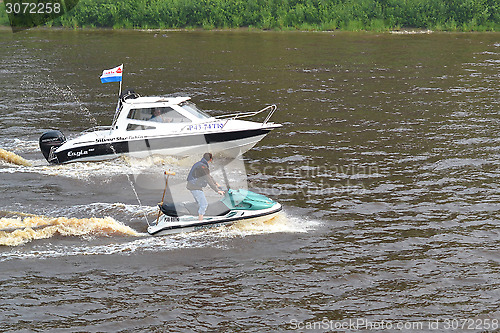 Image of The man on a hydrocycle floats down the river