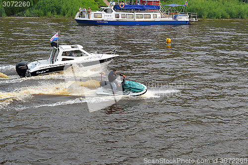 Image of The man on a hydrocycle floats down the river.