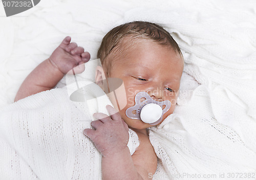 Image of infant with pacifier