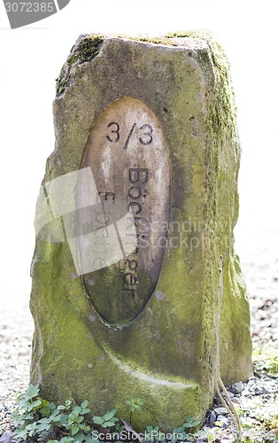 Image of old boundary stone in white background
