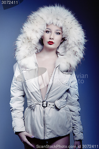 Image of attractive beautiful girl in winter jacket with fur