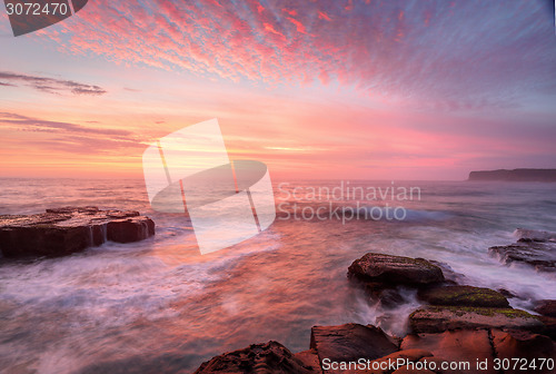 Image of Sunrise skies and white water seas