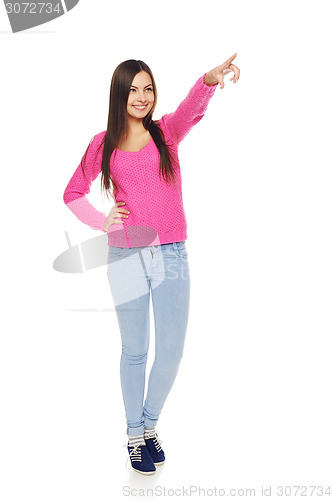 Image of Casual woman pointing at blank copy space