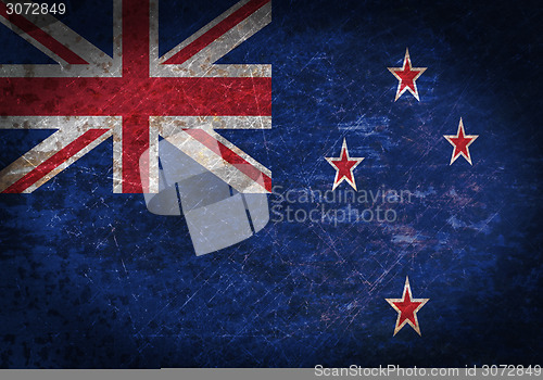 Image of Old rusty metal sign with a flag
