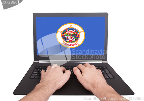 Image of Hands working on laptop, Minnesota
