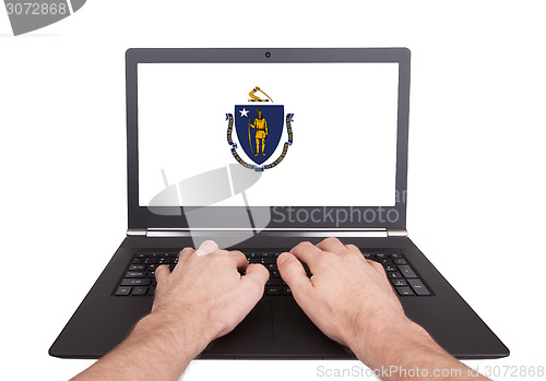 Image of Hands working on laptop, Massachusetts