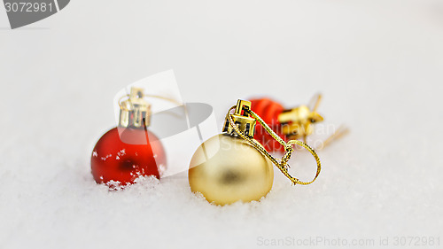 Image of New year decoration balls on white snow