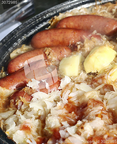 Image of Smoked  sausage with stewed cabbage