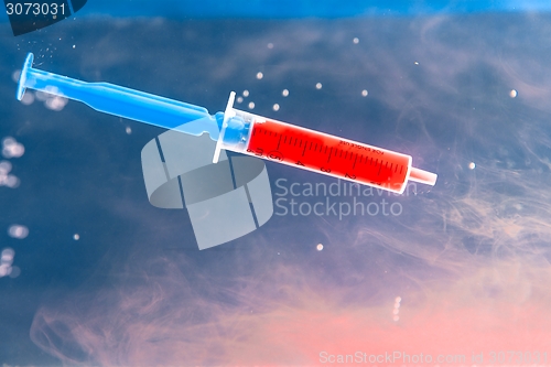 Image of Syringe with red blood 