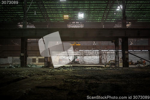 Image of Industrial interior with bulldozer inside