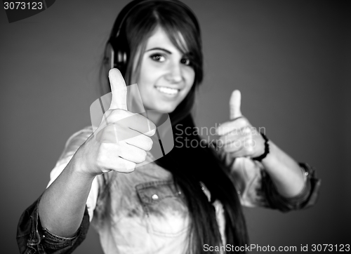 Image of Woman showing thumbs up