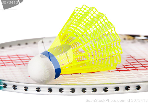 Image of Shuttlecock lying on the badminton racket