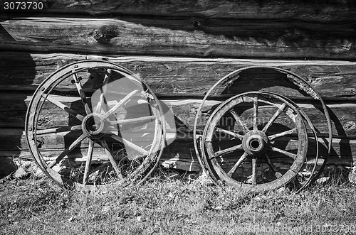 Image of Old wheel from carts in the countryside  