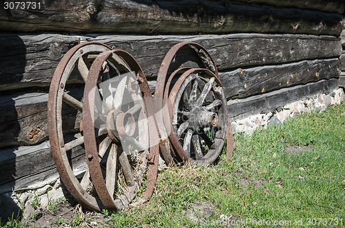 Image of Old wheel from carts in the countryside  