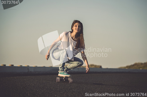 Image of Skater girl making dowhill