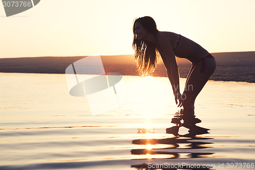 Image of Beautiful woman in the beach