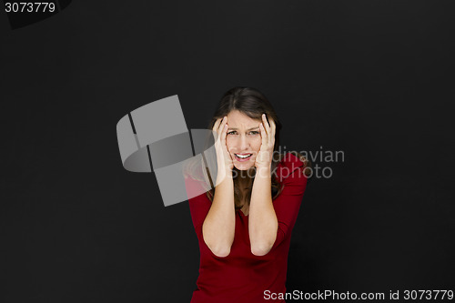 Image of Beautiful female student with a headache