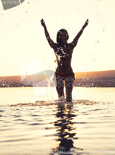 Image of Beautiful woman in the beach