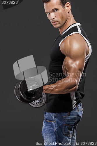 Image of Muscle man lifting weights