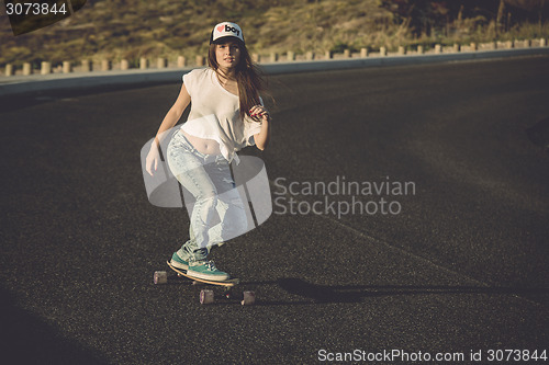 Image of Skater girl making dowhill