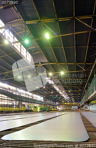 Image of steel plate on conveyor