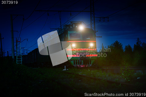 Image of Electric Freight Train Approaching Polyarnye Zori, Russia, at Ni