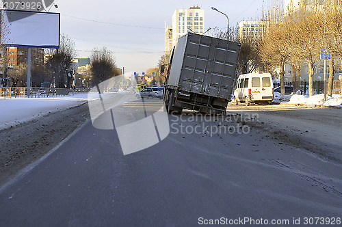 Image of Accident. The truck with the spoiled wheel costs in the middle o