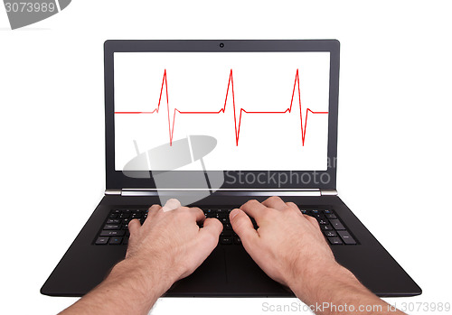 Image of Man working on laptop, heartbeat