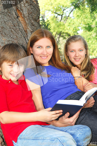 Image of Family reading a book