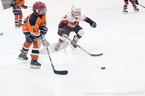 Image of Game between children ice-hockey teams