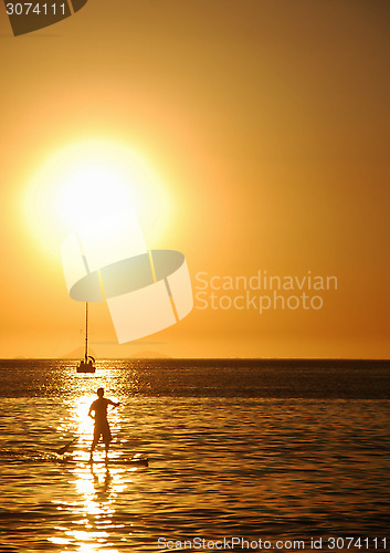 Image of Stand-up on sunset on Itaipu Beach