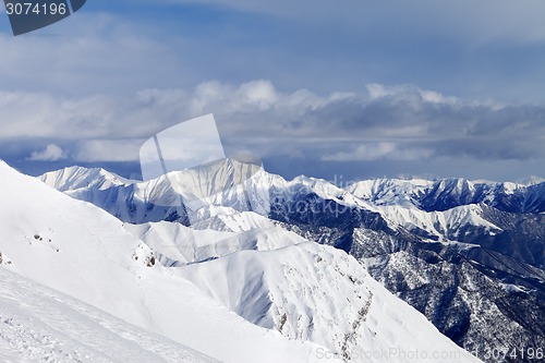 Image of Off-piste slope and snowy mountains