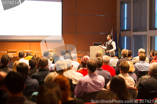 Image of Speaker at Business Conference and Presentation.