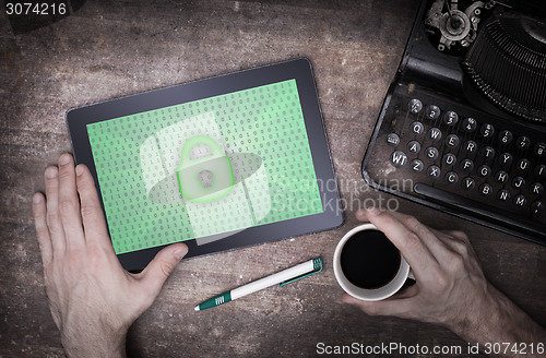 Image of Tablet on a desk, concept of data protection