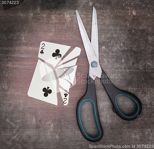 Image of Concept of addiction, card with scissors